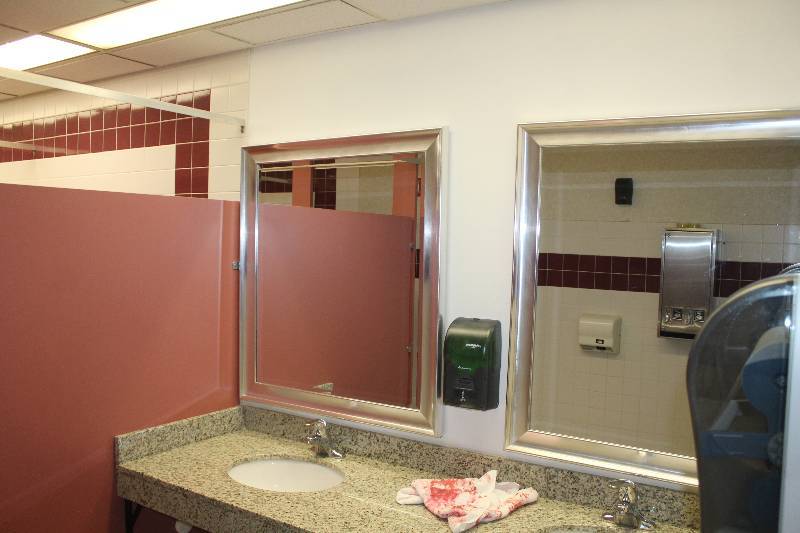 lot 571 image: Lot of (2) Womens Bathroom Framed Wall Mirrors, Soap Dispenser, Towel Dispenser, Garbage Can