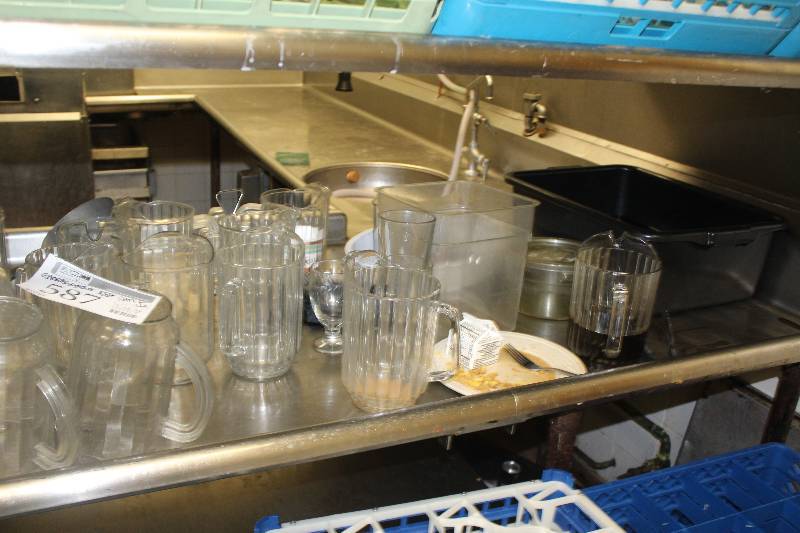 lot 587 image: Shelf Lot Including Plastic Pitchers, Glassware, Trays, And More