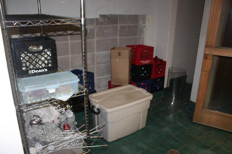 lot 982 image: Contents of Room Including Storage Racks, Storage Bins, Decorations, And More