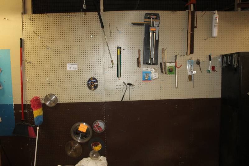 lot 1111 image: Wall Lot of Tools Including Saw Blades, Brushes, Powerglide, Hardware, And More