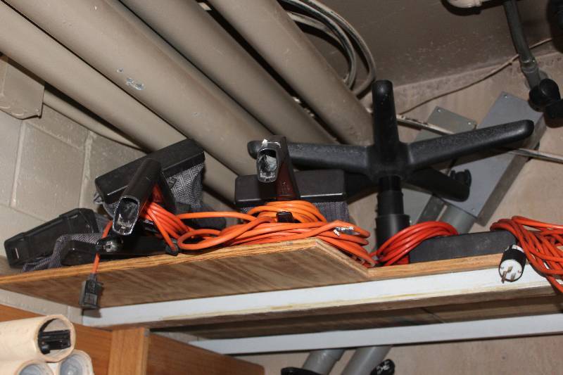lot 1123 image: Upper Shelf Lot Including Hardware, Extension Cords, Hoover Commercial Vacuums, And More