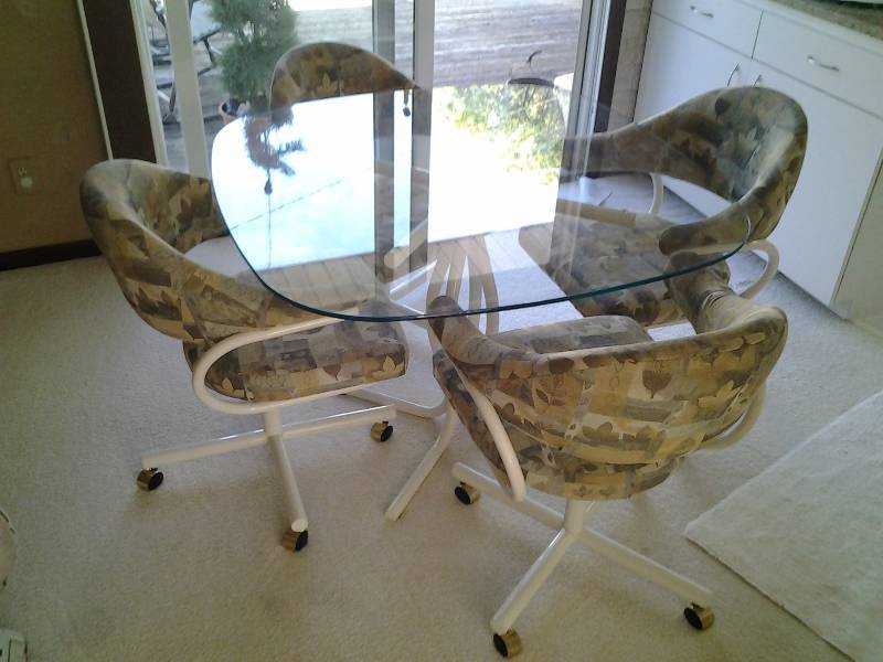 lot 1 image: Glass Dining Set (42 Inch) Table With 4-SwivelRolling Fabric Chairs
