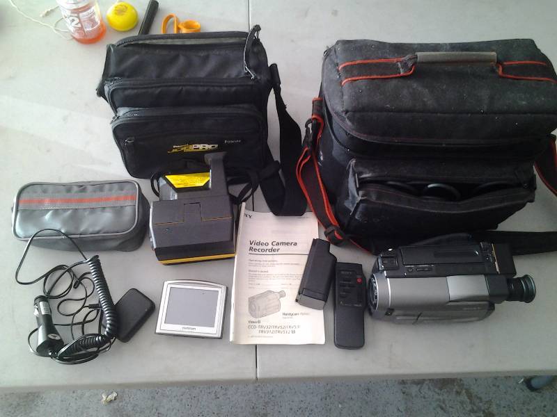 lot 70 image: Tom-Tom GPS, 8mm Movie Camera With Batteries, Charger, Job Pro Polaroid