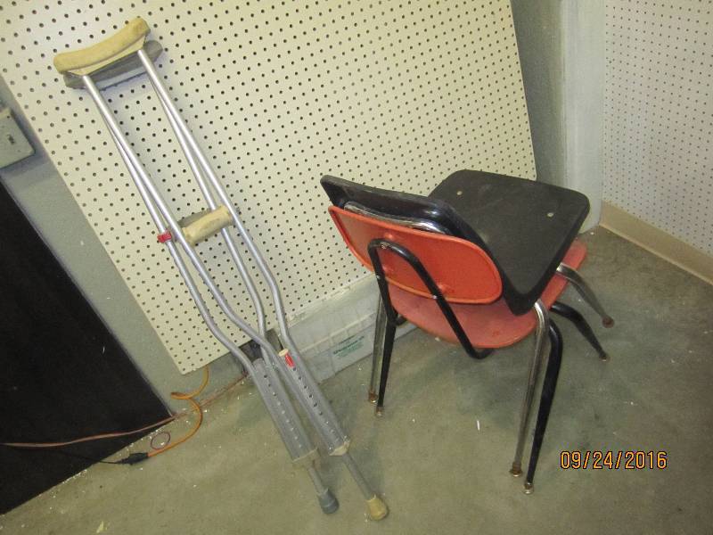 2 chairs and a pair of crutches...