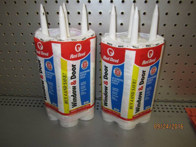 8 tubes of Red Devil caulk...