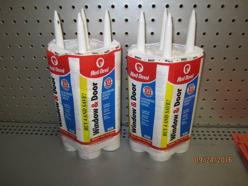 8 tubes of Red Devil caulk...