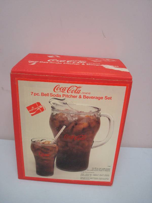 lot 69 image: Set Of Coca Cola Bell Glasses And Pitcher