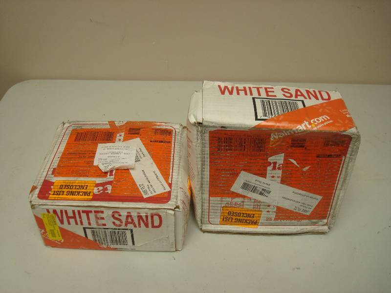 lot 87 image: Pair Of 25 Pound Boxes With White Sand