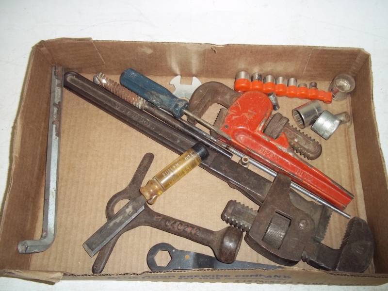 Assorted tools and pipe wrench