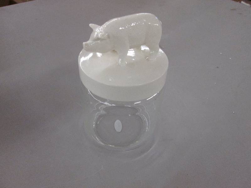 lot 19 image: Pig Figurine Jar, chip in cover...