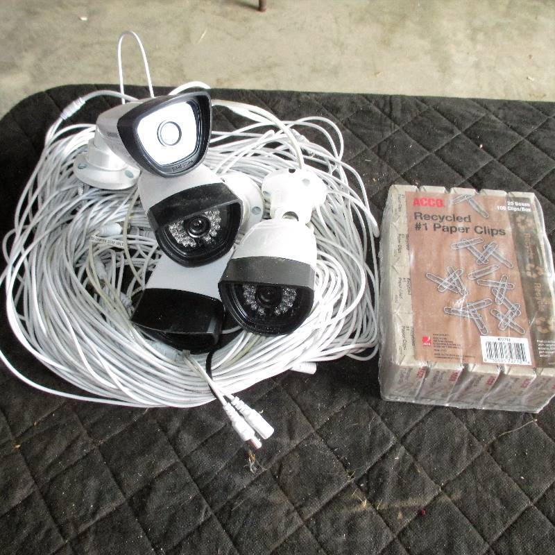 4 SECURITY CAMERAS AND PAPER CLIPS