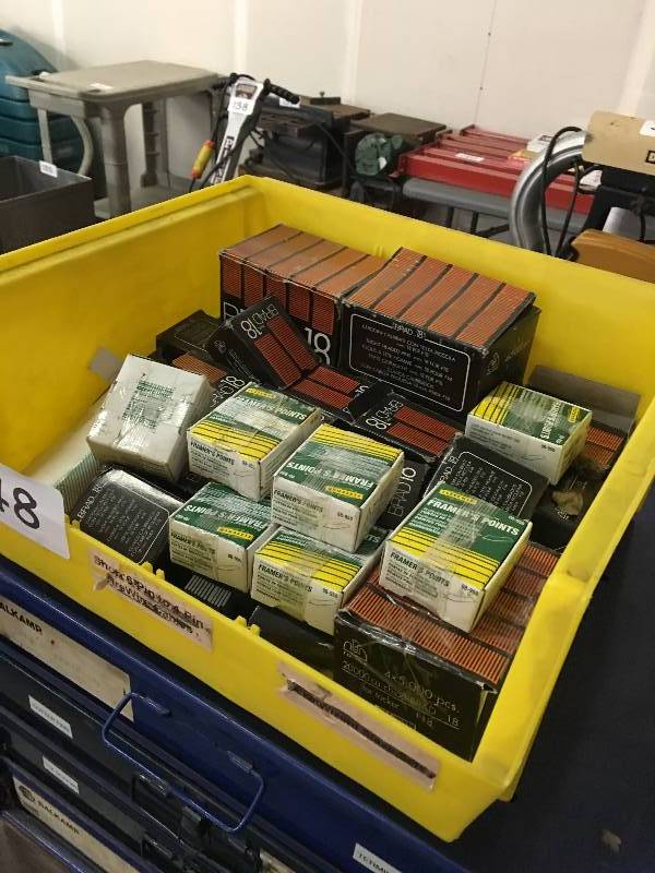 Plastic bin of brad nails