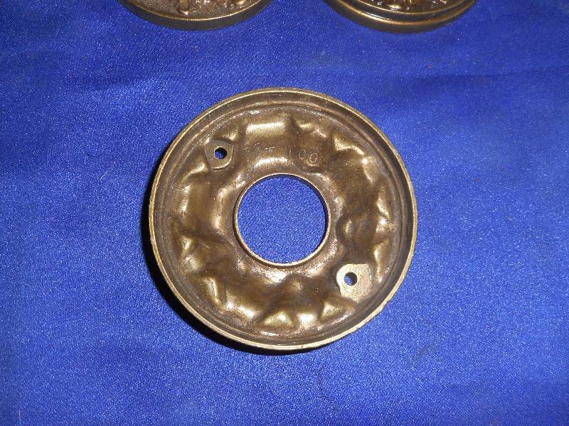 lot 11 image: 3 ANTIQUE BRASS DOOR KNOB PLATES