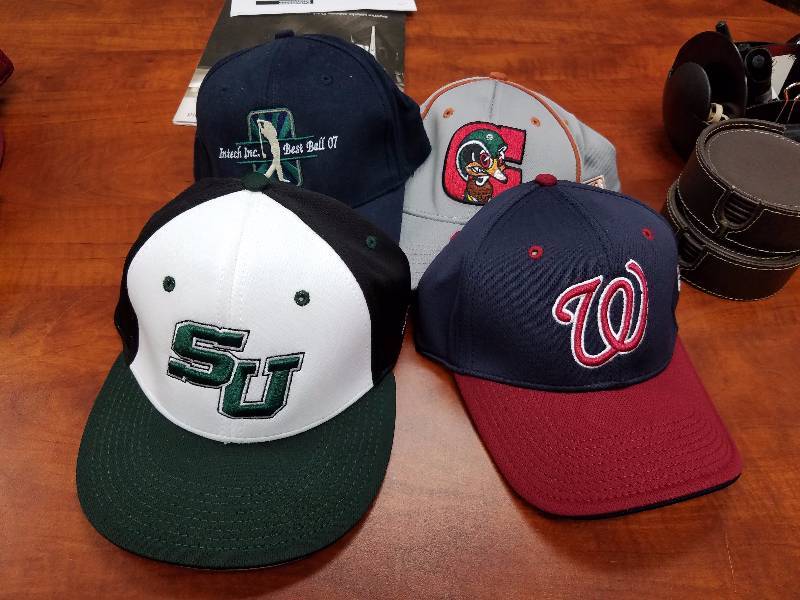 lot 3 image: Brand New 4 Verity Logo Hats