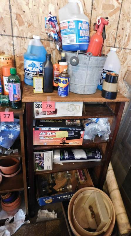 bookshelf full of garage items