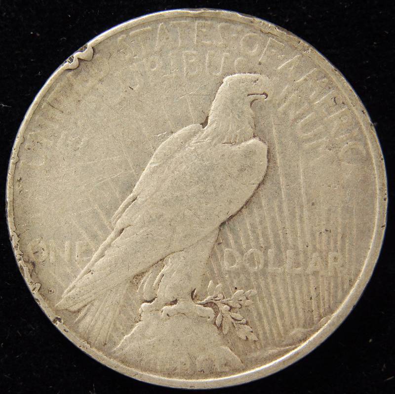 1923-D PEACE SILVER DOLLAR IN LOW GRADE