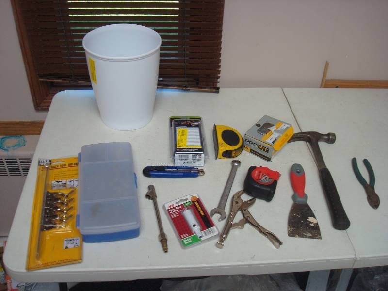 Small Trash Can With Some Tools