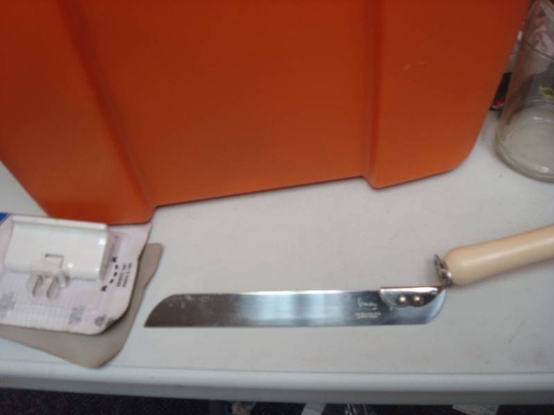 Orange Bin With Some Mixed Items