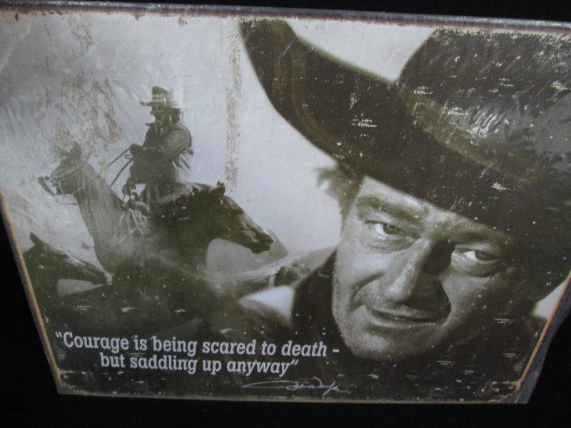 lot 56 image: John Wayne Tin Sign Courage