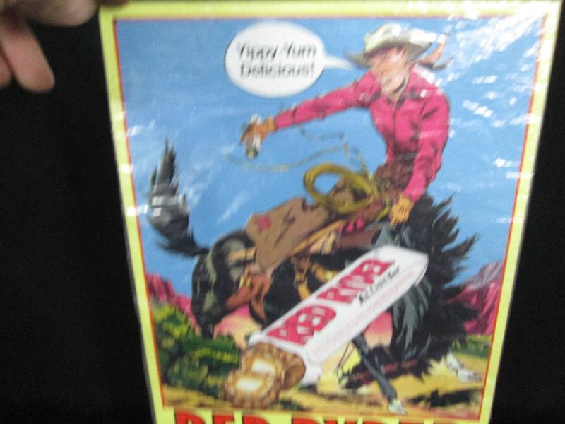 lot 60 image: Collectible Embossed Tin Sign Red Ryder  Candy Bar