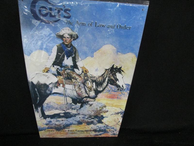 lot 150 image: Collectable Embossed Tin Sign Colt Firearms