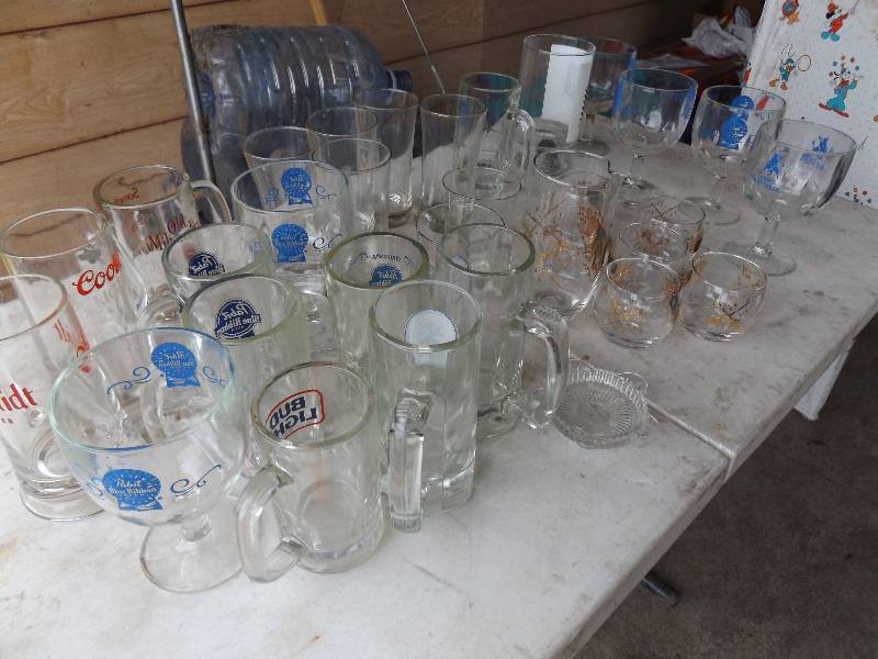 lot 29 image: Beer mugs, some with beer names, gl...