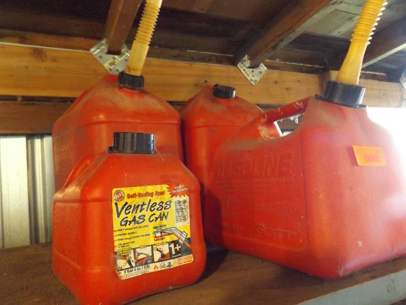 lot 110 image: Plastic Gas cans...