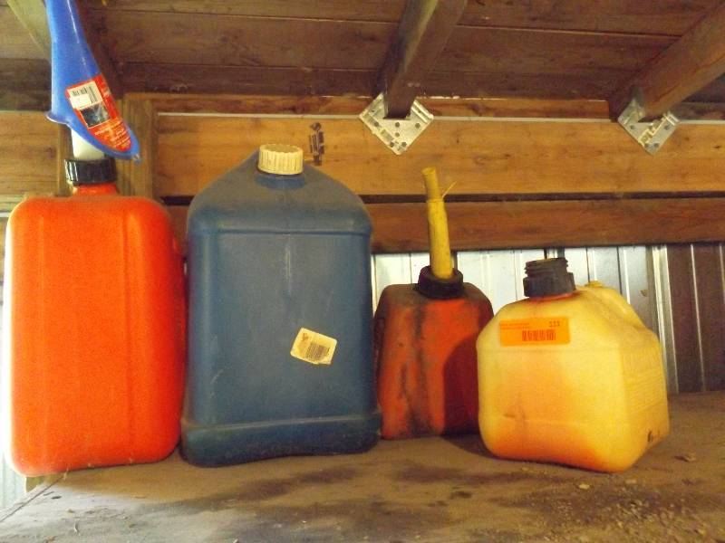 lot 111 image: Plastic Gas cans and kerosene can...