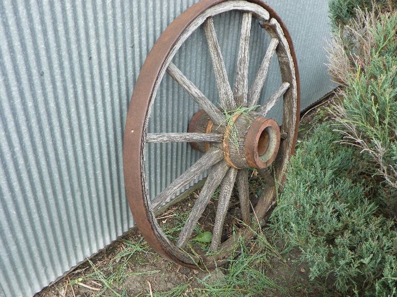 lot 18 image: Vintage large wood wagon wheel with...