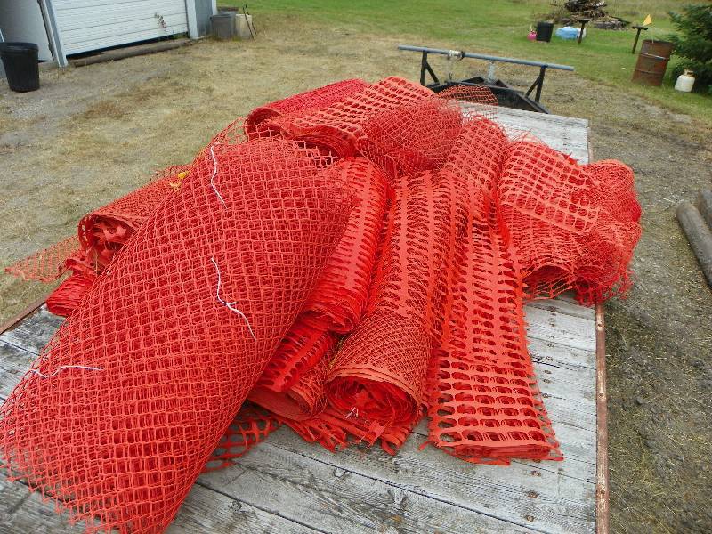 lot 24 image: Orange plastic warning fencing...