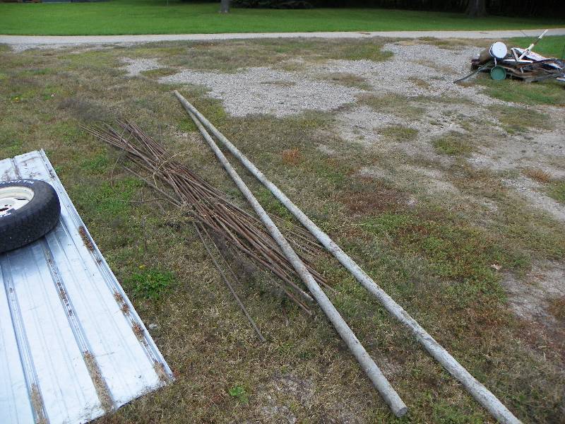lot 201 image: Rebar and metal poles filled with c...