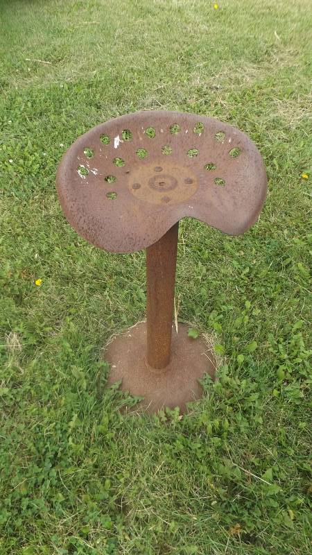 lot 384 image: Tractor seat campfire stool...