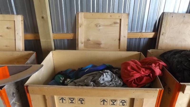 lot 391 image: Crate with tarp, chair, canopy, bas...