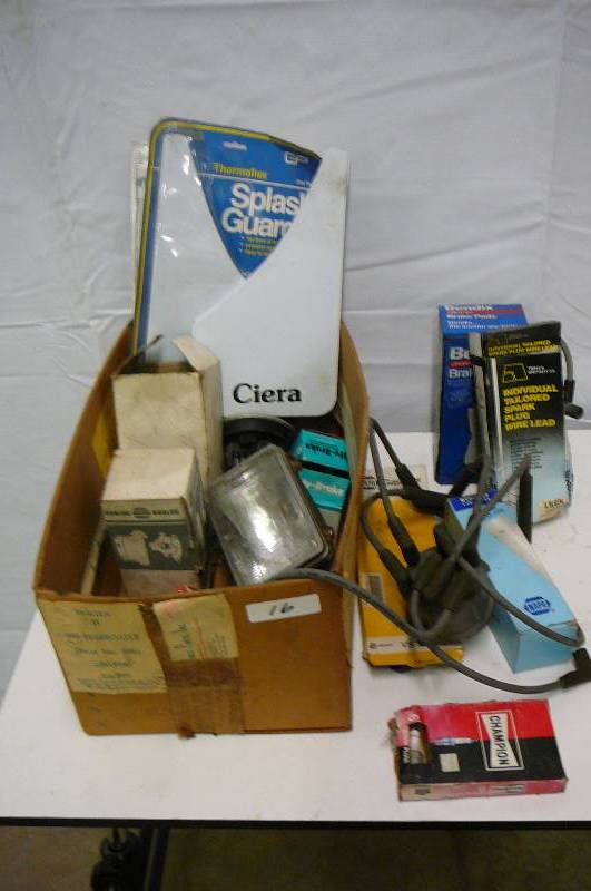 Box of misc. Auto Parts, Brakes, Plug wires, spark plugs, mud flaps, wiper blades