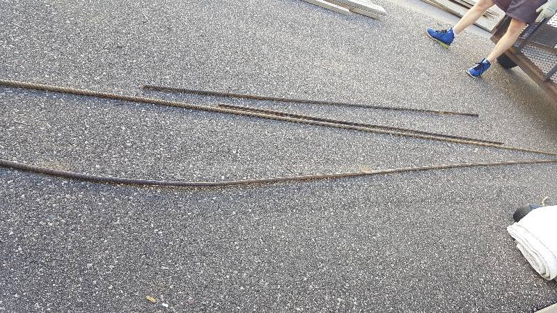lot 15 image: 4 metal rods, two 8 feet, and two 20 feet