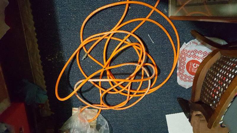 lot 21 image: Used orange air hose 54 feet long