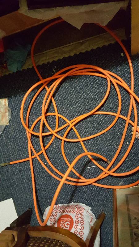 lot 22 image: Used orange air hose 60 feet long