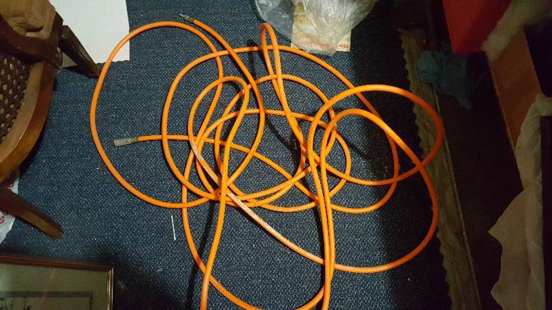 lot 23 image: Used orange air hose 58 feet long
