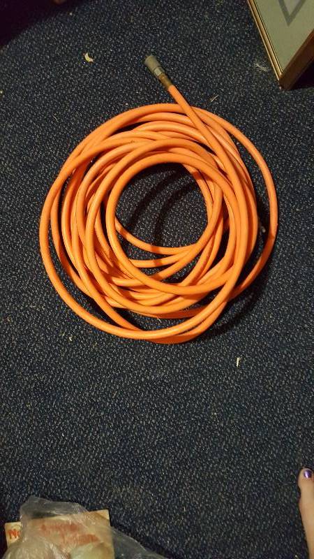 lot 24 image: Used orange air hose 54 feet long