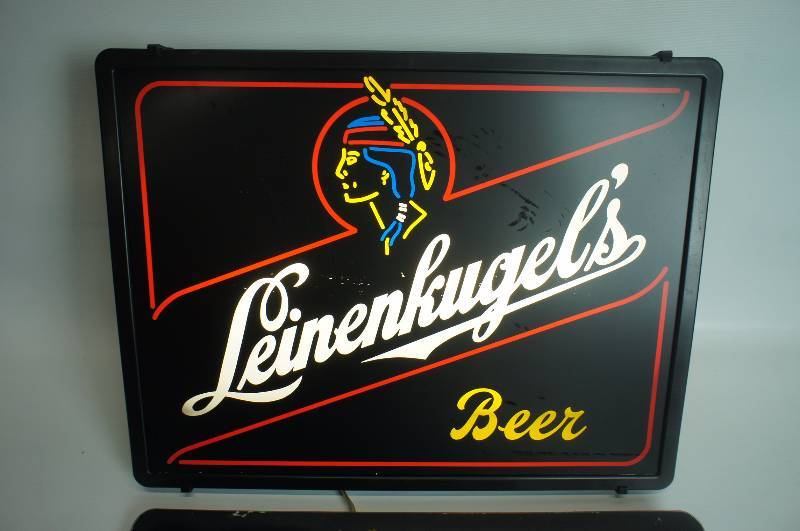 lot 45 image: Leinenkugels neo-neon lighted sign with indian maiden and extra cover 15 x 20