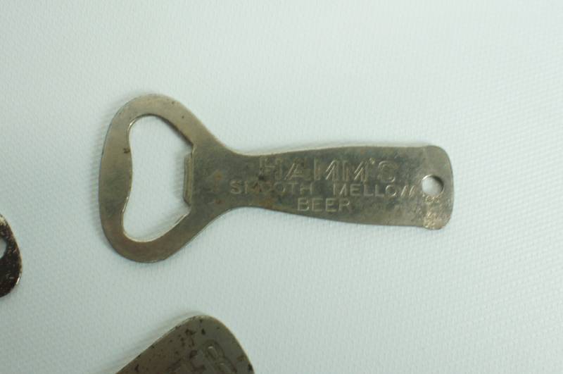 lot 72 image: Three vintage Hamms beer bottle openers
