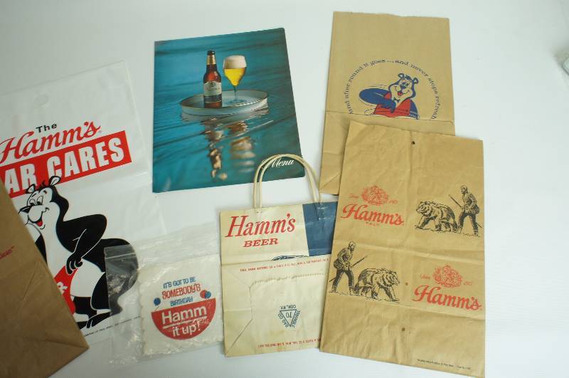 lot 74 image: Hamms beer group four different Hamms take home sacks, litter bag, napkins & menu cover