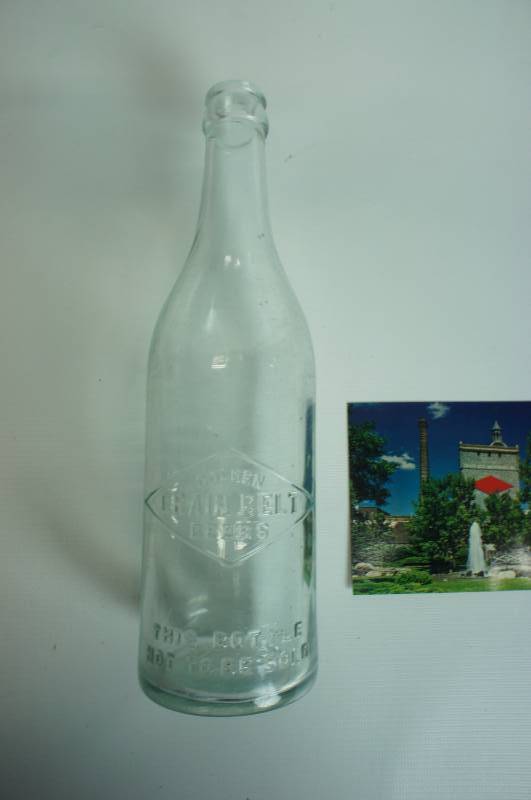 lot 83 image: Early embossed Grain Belt beer bottle & unused postcard