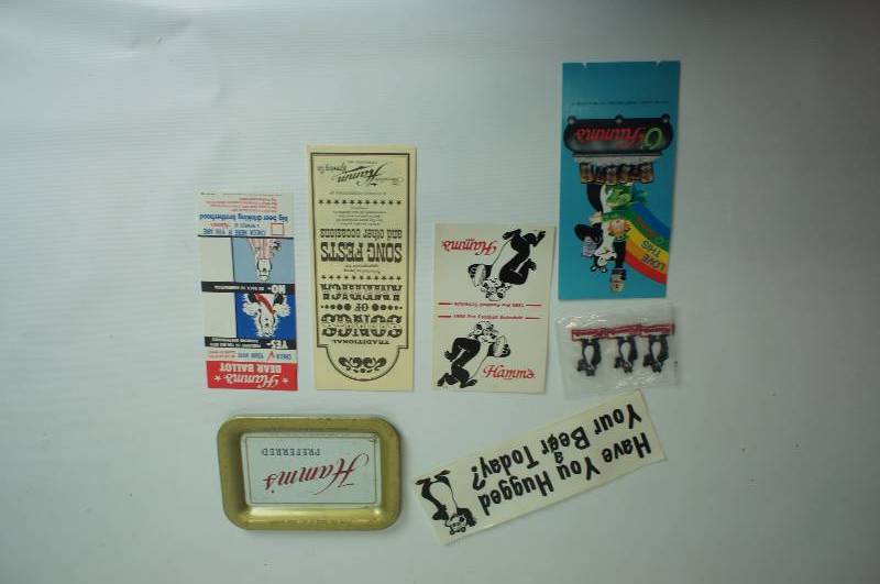 lot 60 image: Hamms Beer group bumper sticker, bear patches, schedule, table tent, song book, ballot and tip tray