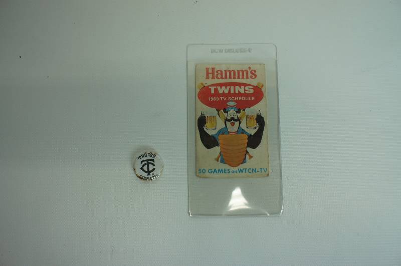 lot 67 image: Hamms beer Minnesota Twins 1969 TV schedule and vintage Twins pin