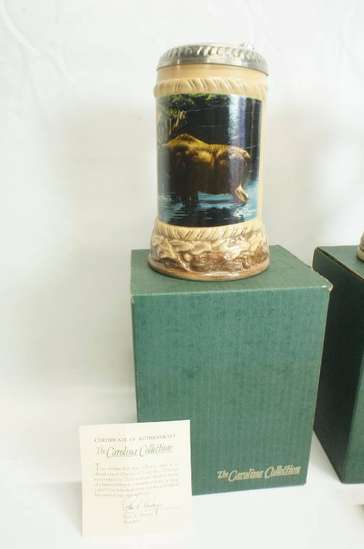 lot 197 image: Lot of (3) three Steins  Moosehead, Strohs Heritage Series V, Millstream Brewing