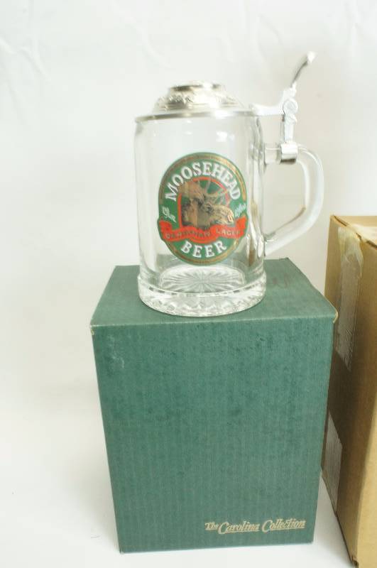lot 198 image: Lot of (3) three Steins  Moosehead, Strohs Hertage Series V, Budweiser 1989 Stein