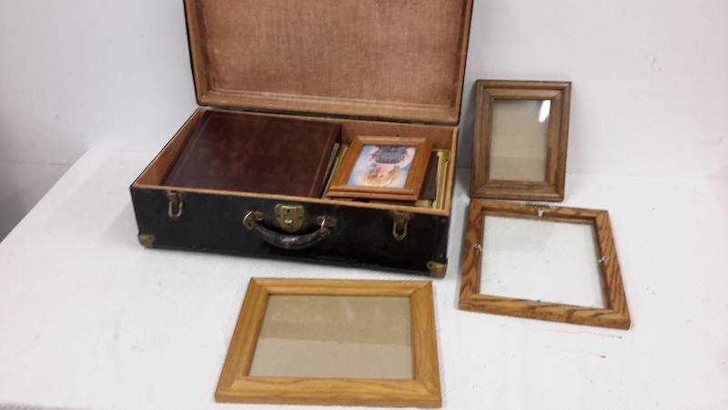 Vintage metal case filled with picture frames