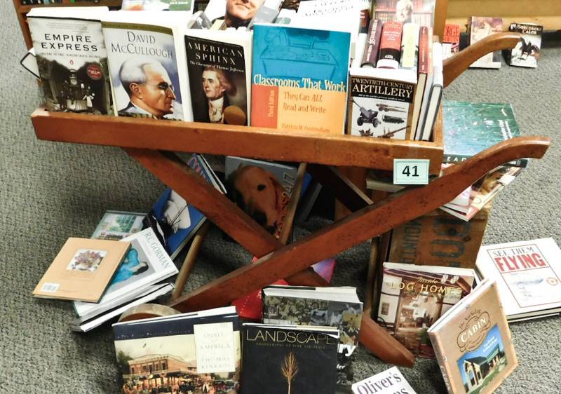 folding wheeled cart used to hold books