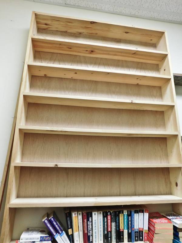 Back room overstock paperback bookshelves